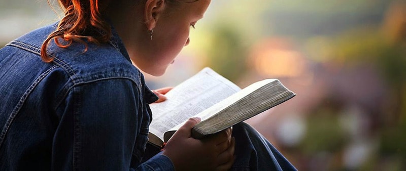 girl reading bible no attribution